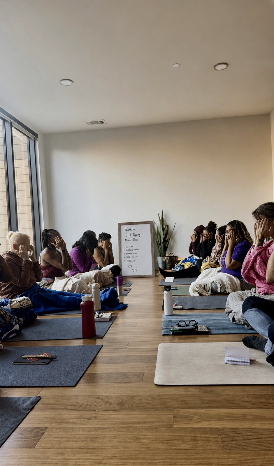 Women facing each other during an EFT tapping workshop