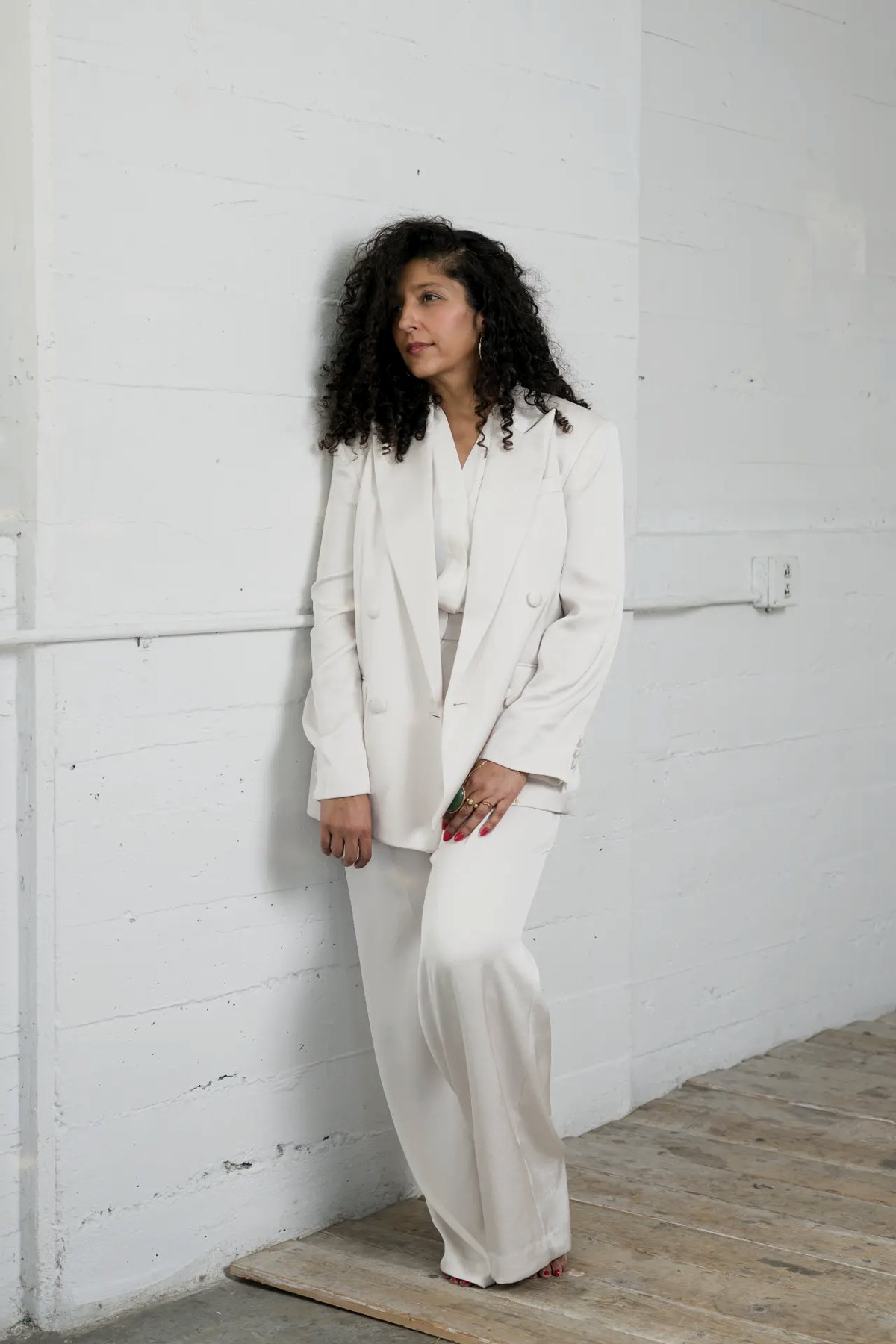 Tania Hansraj in a white suit